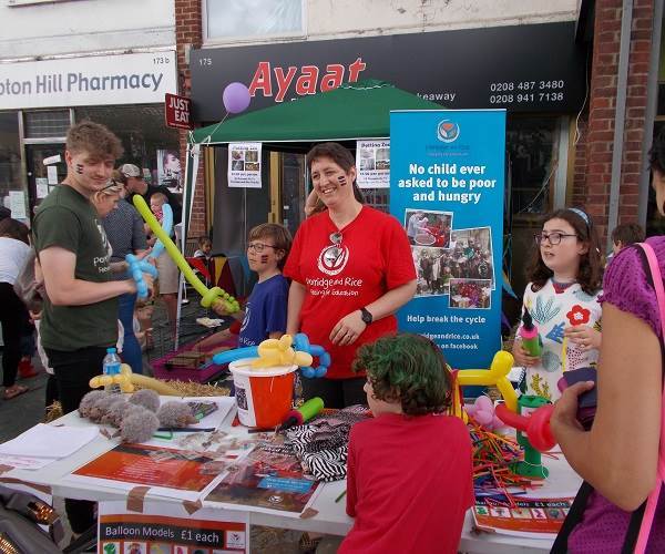 the petting zoo and balloon modelling by volunteers raising money for Porridge and Rice on Hampton Hill 
      high street
